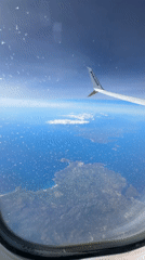 Passenger documents aerial views from Ryanair flight window seat