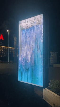 Digital waterfall animation displayed on LED screen in Budva