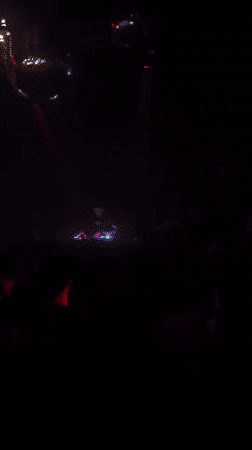 Late-night club scene in Iquique with DJ and neon lights