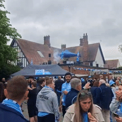 Sports fans gather with live band outside Coventry pub