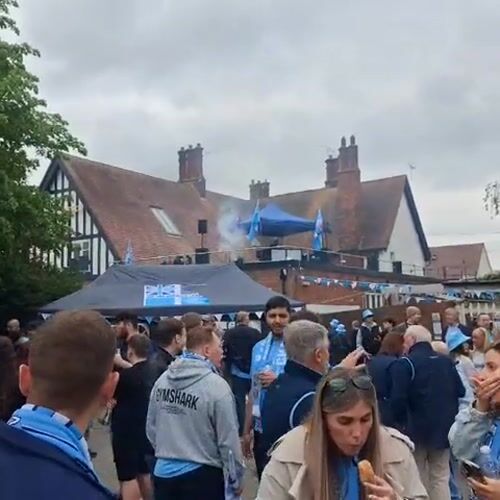 Sports fans gather with live band outside Coventry pub