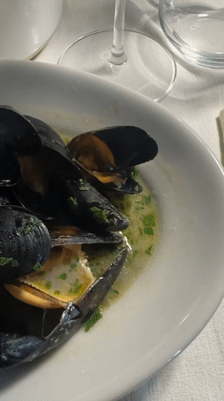 Mussels and a burger at a Milan restaurant