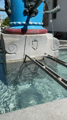 Tourist documents Lucerne's painted buildings and historic fountain