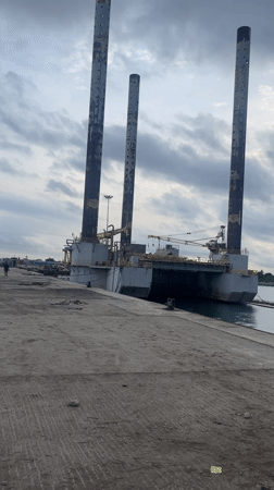 Industrial vessel with tower structures docked at Nigerian port