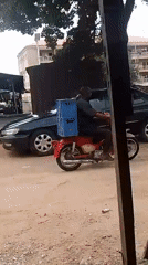 Everyday movement and goods-carrying along a dusty community path