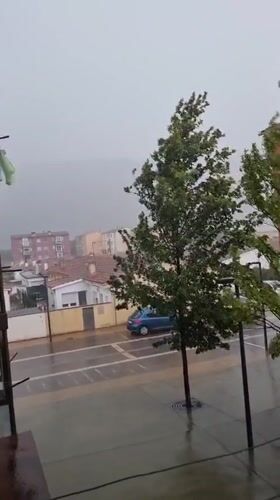 Intense hailstorm blankets Sant Joan Les Fonts streets and buildings