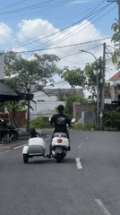 Scooter family transport and festival preparations documented in North Kuta