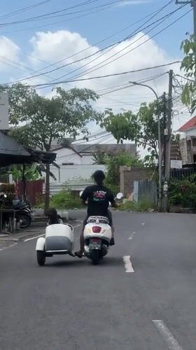 Scooter family transport and festival preparations documented in North Kuta