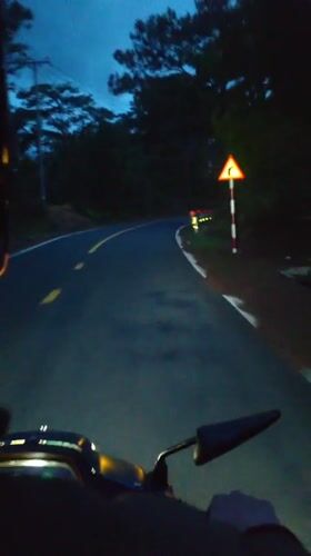 Motorcyclist records evening ride on winding Vietnam road