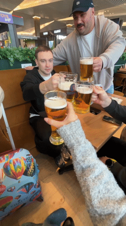Travelers drink beer, read Tolstoy at Russian airport