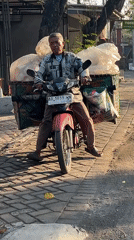Morning motorcycle commute through Gelam's main road