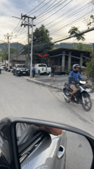 Regular traffic flow documented in Thai town street scene