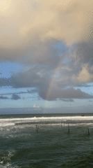 Witness documents Sri Lankan coastal scenes with rainbow