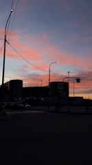 Dramatic pink-purple twilight sky captured over Russian city