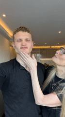 Playful interaction between man and woman captured in London apartment
