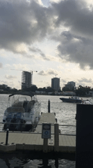 White boat docked at Ikoyi harbor amid construction activity