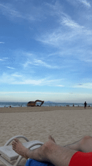 Tourist documents morning beach visit in Đà Nẵng, Vietnam