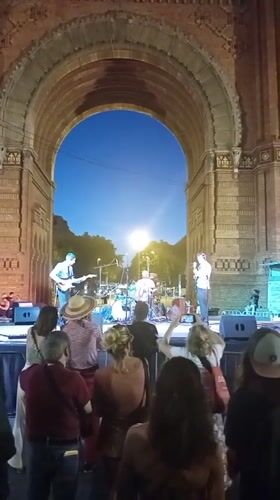 Live band performs at dusk in front of Arc de Triomf