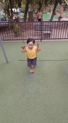 Kid works through the rides at a Mojokerto playground