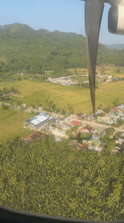 Aerial view captured over Del Carmen, Philippines from small aircraft