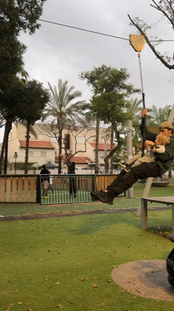 Family playground activity and flag displays in Kiryat Bialik