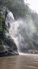 Rafting group gathers at waterfall in Payangan, Indonesia