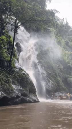 Rafting group gathers at waterfall in Payangan, Indonesia