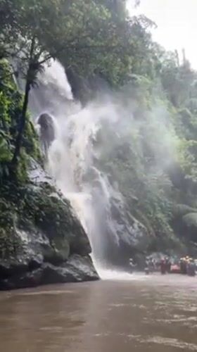 Rafting group gathers at waterfall in Payangan, Indonesia