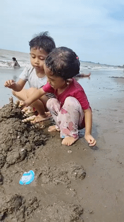 Beach play on the shores of Lhokseumawe, Indonesia
