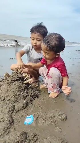 Beach play on the shores of Lhokseumawe, Indonesia
