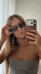 Woman takes selfie indoors in Khimki, Russia
