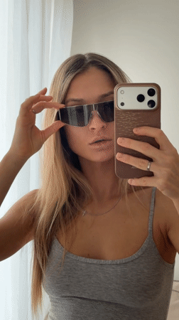 Woman takes selfie indoors in Khimki, Russia