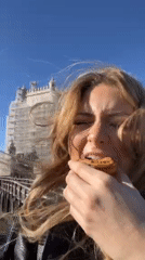 Tourist documents morning sightseeing tour of historic Lisbon landmarks