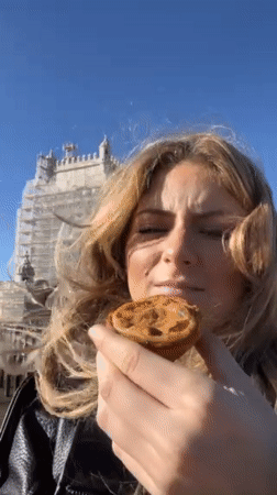 Tourist documents morning sightseeing tour of historic Lisbon landmarks