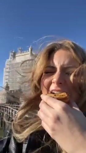Tourist documents morning sightseeing tour of historic Lisbon landmarks