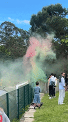 Youth soccer celebration with colorful smoke in Porto