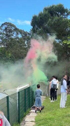 Youth soccer celebration with colorful smoke in Porto