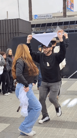 Dancing and clapping outside Polimedica in Puente Alto