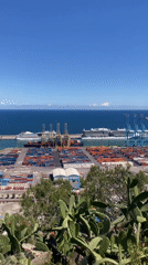 Outdoor guitar performance overlooking Barcelona port draws afternoon crowd