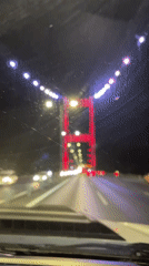 Nighttime drive across a lit bridge in Beykoz