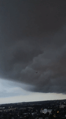Storm clouds move over Berlin at dusk