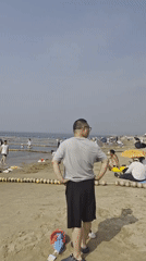 Crowded summer beach day at Beidaihe, Qinhuangdao