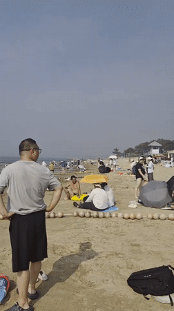 Crowded summer beach day at Beidaihe, Qinhuangdao