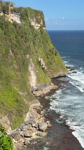 Clifftop restaurant and crashing waves, Kuta Selatan