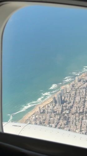 Aerial view captures Larnaca coastline from airplane window