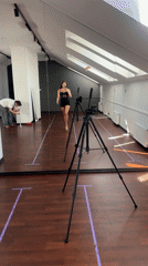 Woman films selfie in Riga dance studio during photoshoot