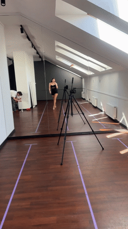 Woman films selfie in Riga dance studio during photoshoot