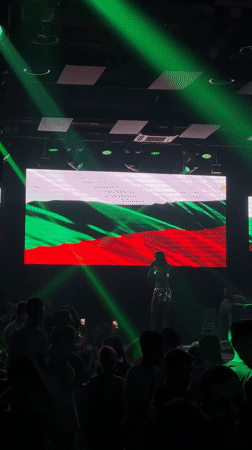 Live indoor concert with Bulgarian flag backdrop in Tsarevo