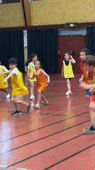 Children play organized games at La Fouillouse gymnasium