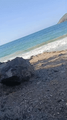 Woman spends evening taking selfies on Venezuelan rocky coastline